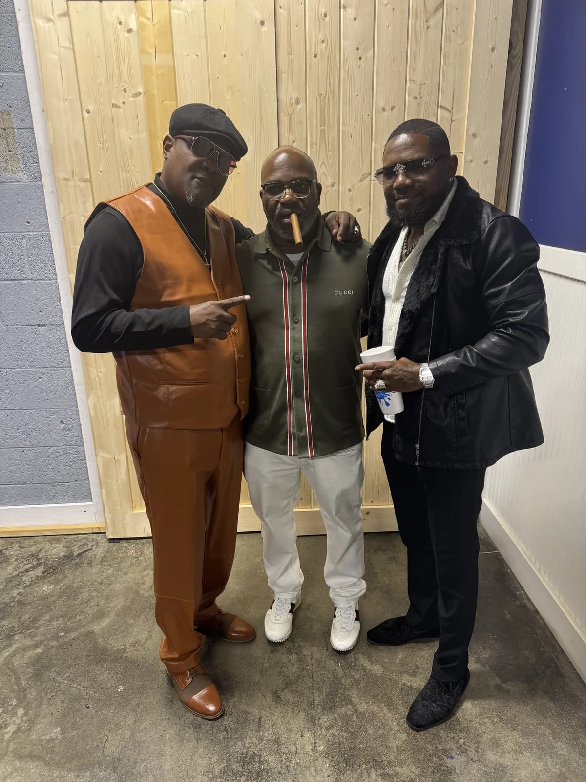 Three friends of the brand posing backstage