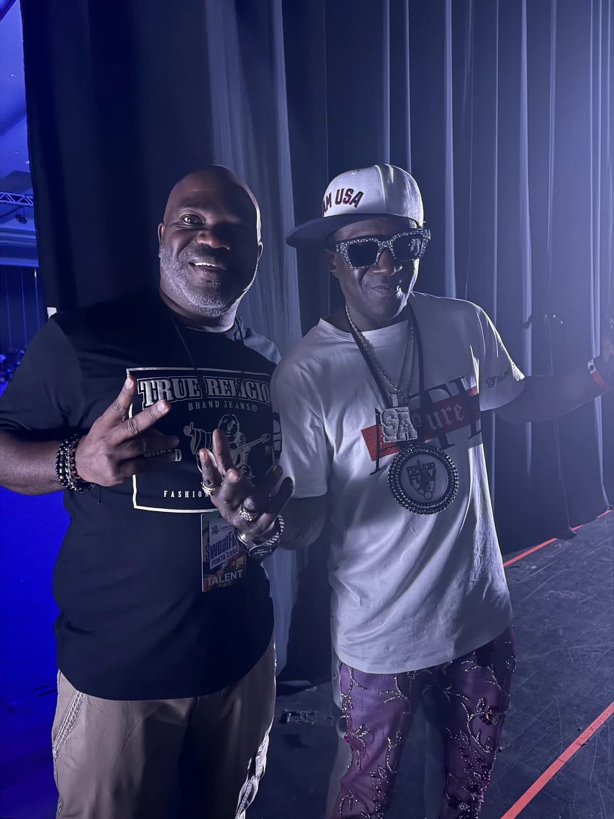 Posing backstage with Flavor Flav at SweatFest Punta Cana